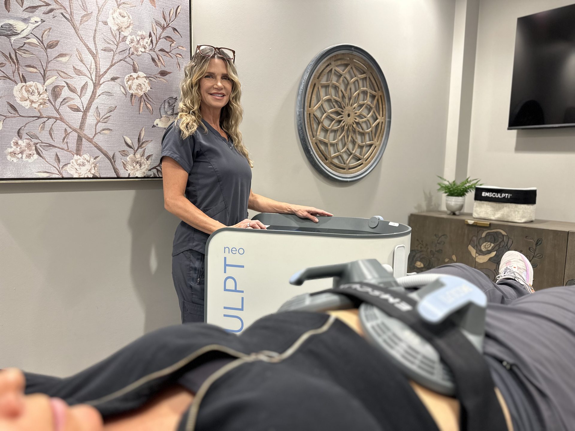 Center Manager Kristyn with a patient during an Emsculpt NEO treatment at Shape Med Centers in Ballantyne, Charlotte